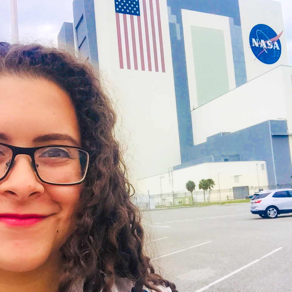 Ely in front of the NASA Control Center buidling.