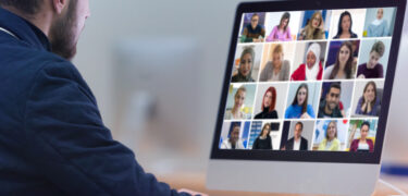A man having a video conference.