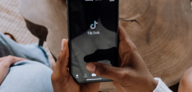 A person using TikTok on their phone.