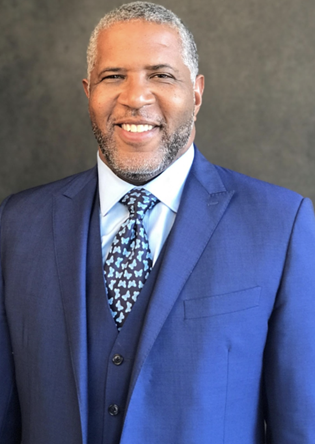 Headshot of Robert F. Smith wearing a blue suit and white collared shirt