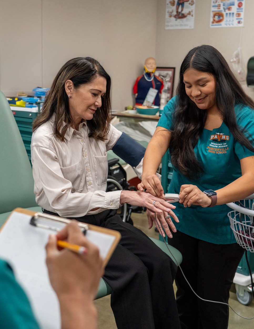 Teacher working with student on work-based learning project